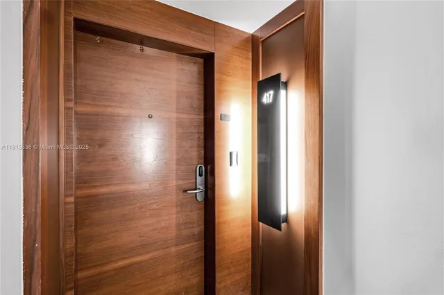 a bathroom with a glass door shower and a sink