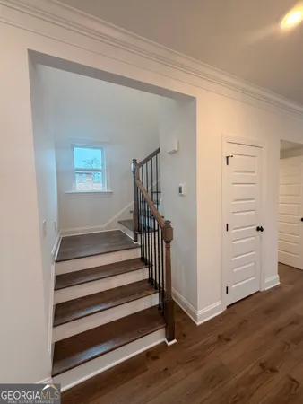 a view of entryway with wooden floor