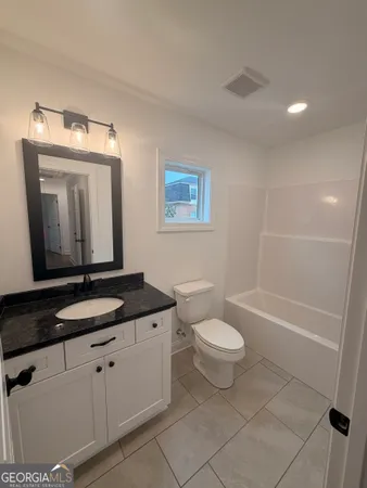 a view of wooden floor in an empty room