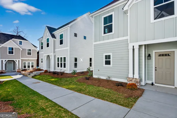 a front view of a house with yard