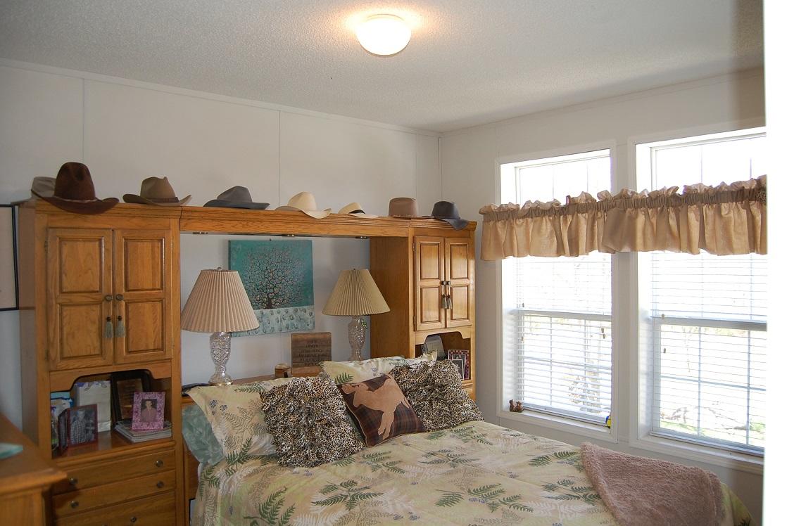 278 Dusty Rock Road Northwest Riner, VA 24149 - Photo 11 of 21 a bedroom with furniture and a large window
