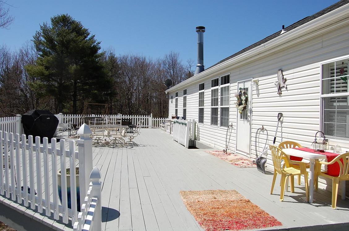 278 Dusty Rock Road Northwest Riner, VA 24149 - Photo 16 of 21 a view of balcony with a patio and wooden fence