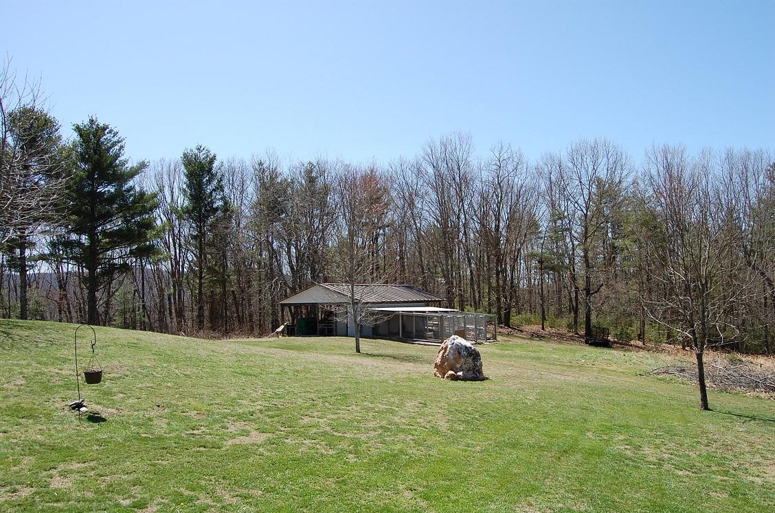 278 Dusty Rock Road Northwest Riner, VA 24149 - Photo 19 of 21 a house view with a garden space
