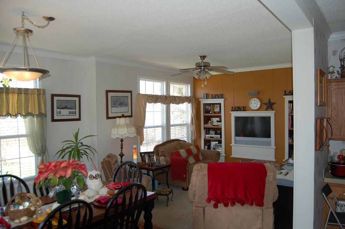 278 Dusty Rock Road Northwest Riner, VA 24149 - Photo 7 of 21 a living room with furniture a chandelier and a flat screen tv