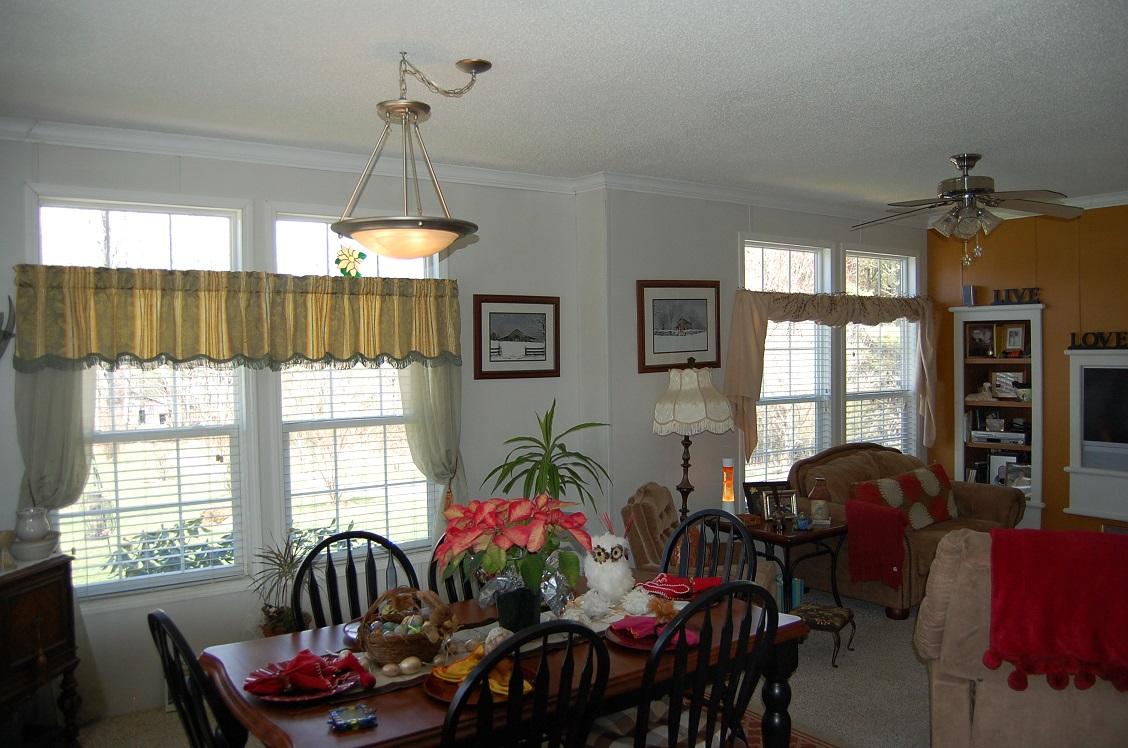 278 Dusty Rock Road Northwest Riner, VA 24149 - Photo 8 of 21 a living room with furniture and a chandelier