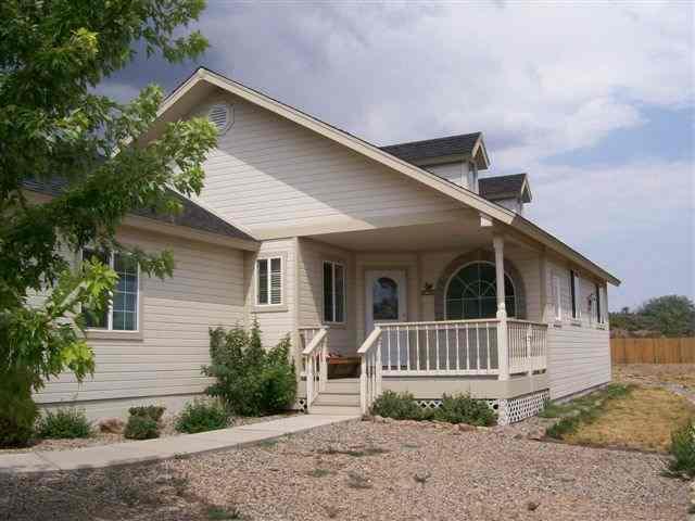 540 Birch Court Rifle, CO 81650 - Photo 1 of 5 a view of a house with a yard