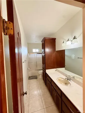 a bathroom with a double vanity sink and mirror