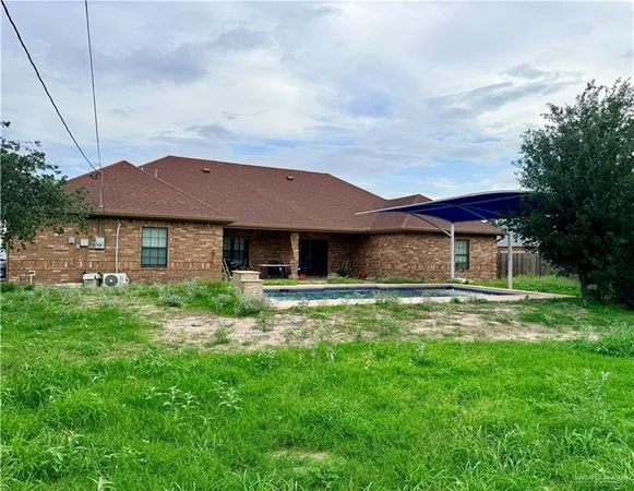 a view of a yard in front of a house