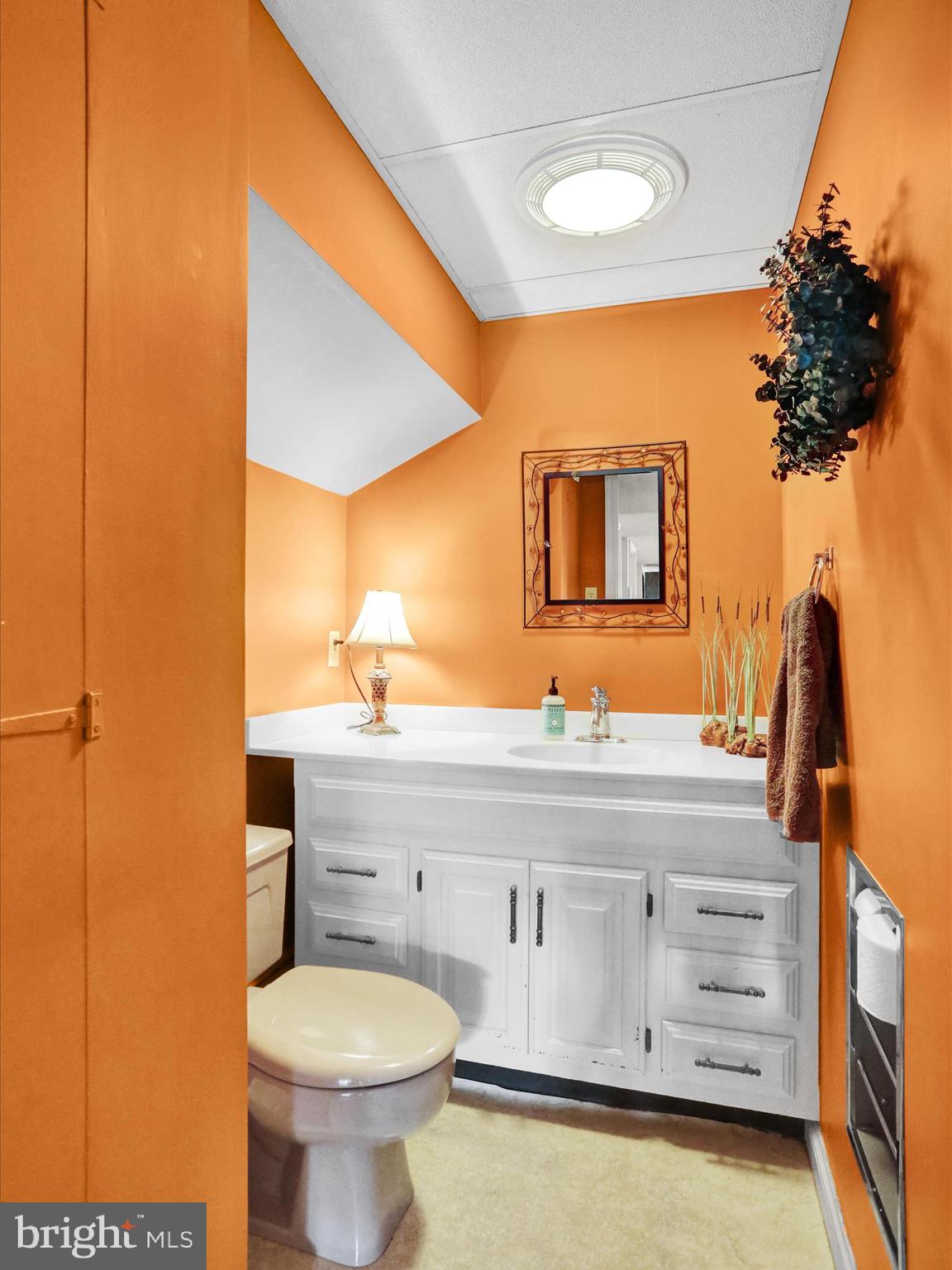 115 Mayer Street Reading, PA 19606 - Photo 21 of 48 a bathroom with a sink a mirror and a toilet