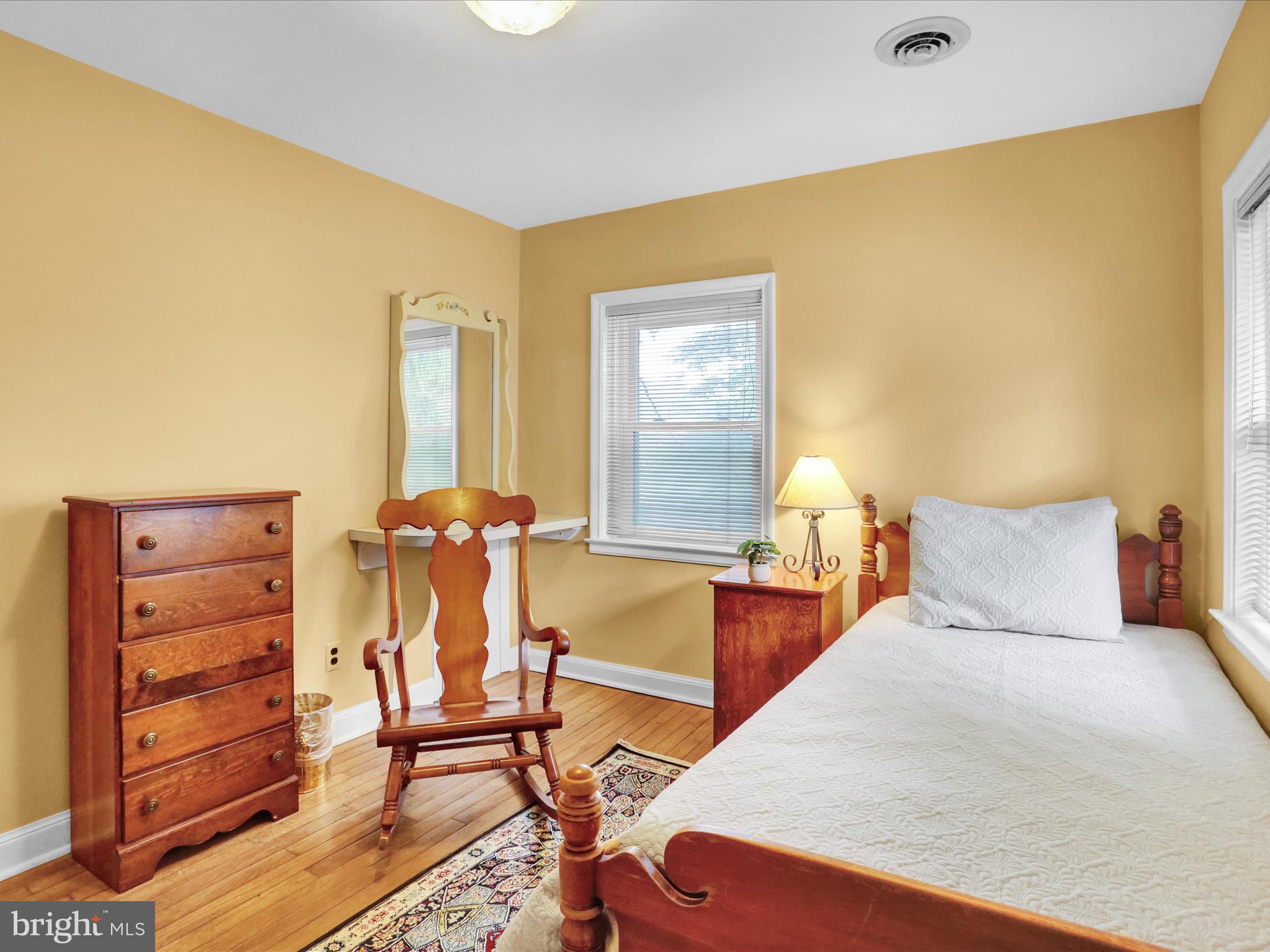 115 Mayer Street Reading, PA 19606 - Photo 30 of 48 a bedroom with a bed and wooden floor