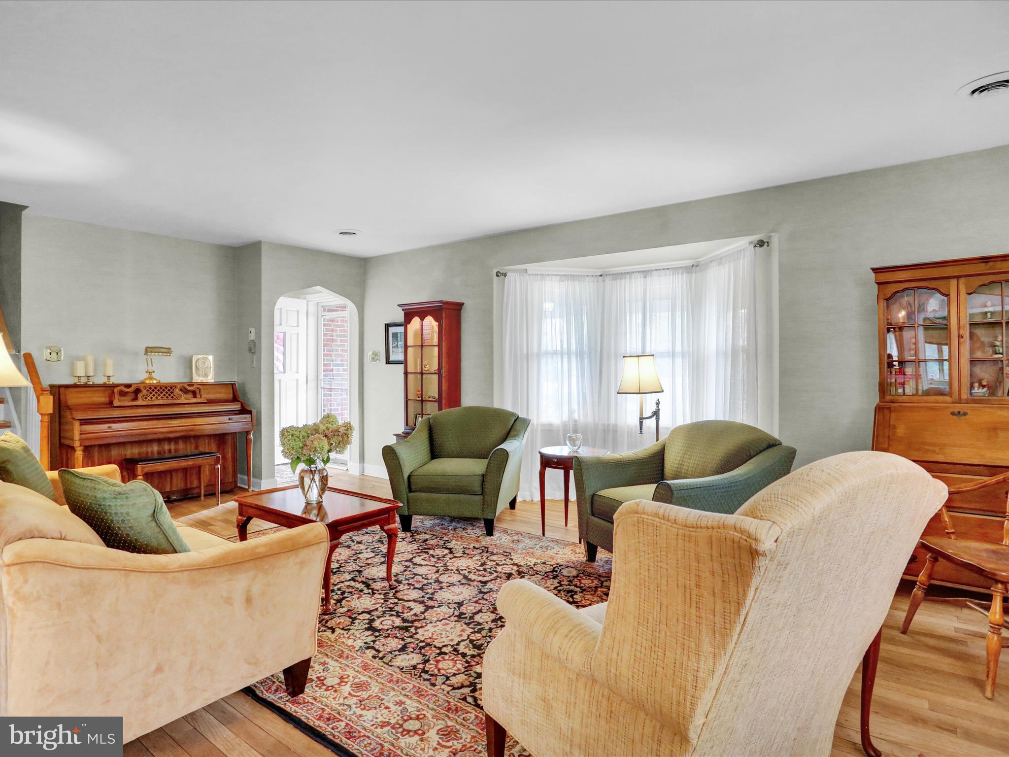 115 Mayer Street Reading, PA 19606 - Photo 7 of 48 a living room with furniture a ceiling fan and a window