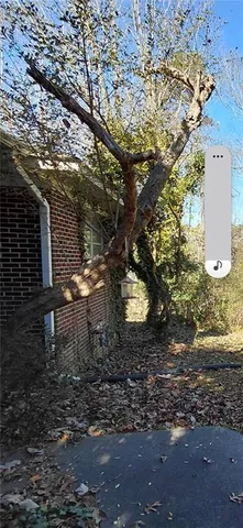 a backyard of a house with a yard and outdoor seating