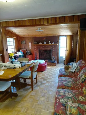 a living room with fireplace furniture and a fireplace