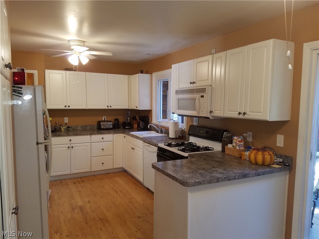 48061 North Ridge Road Amherst, OH 44001 - Photo 15 of 22 This updated kitchen offers lots of natural sunlight, ceiling fan, adjacent to enclosed porch