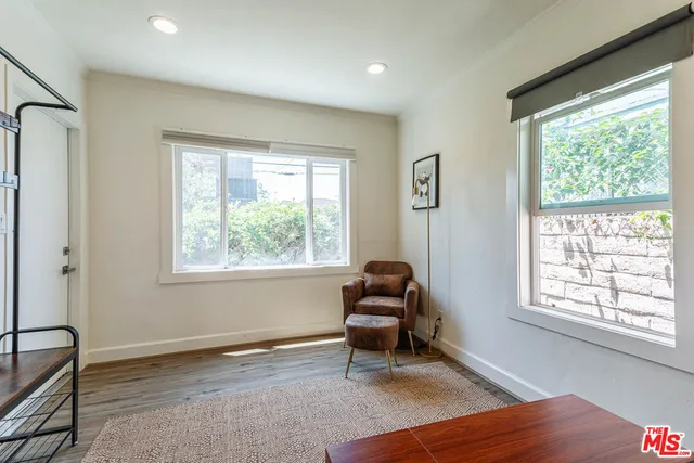 a living room with furniture and a table