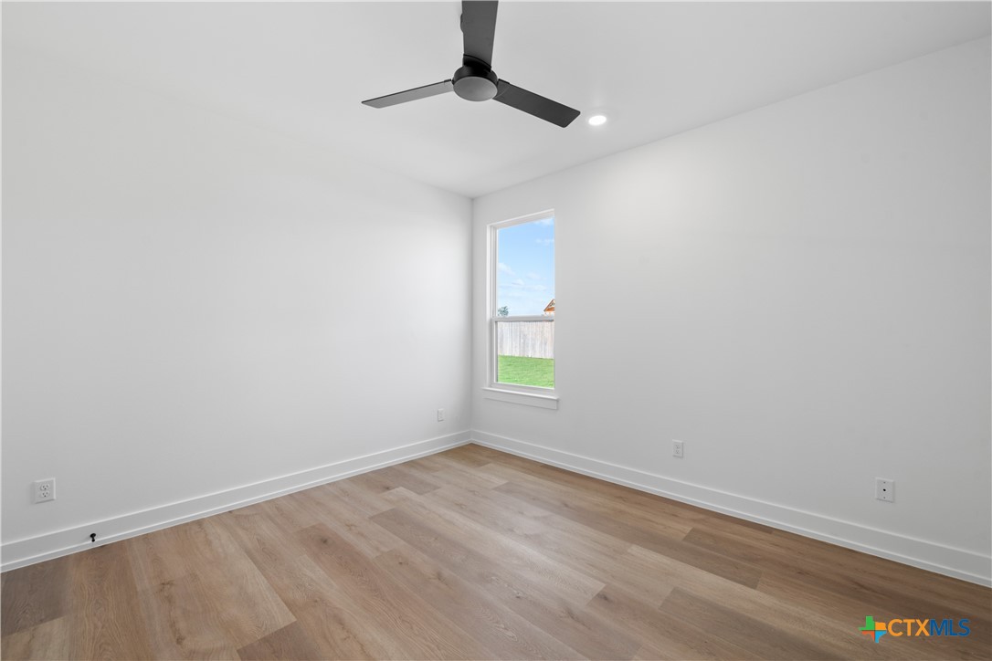 6807 Lacey Oak Road Salado, TX 76571 - Photo 15 of 41 a view of room with window and ceiling fan