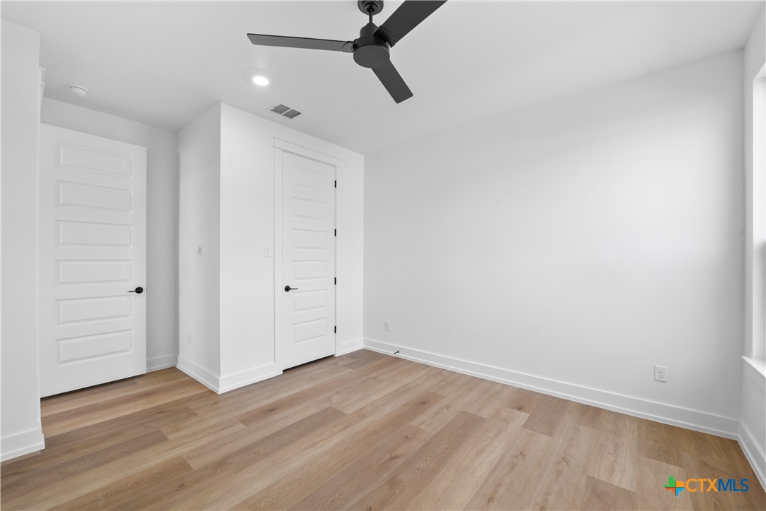 6807 Lacey Oak Road Salado, TX 76571 - Photo 16 of 41 wooden floor in an empty room