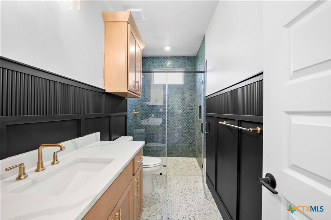 6807 Lacey Oak Road Salado, TX 76571 - Photo 20 of 41 a bathroom with a sink and a mirror