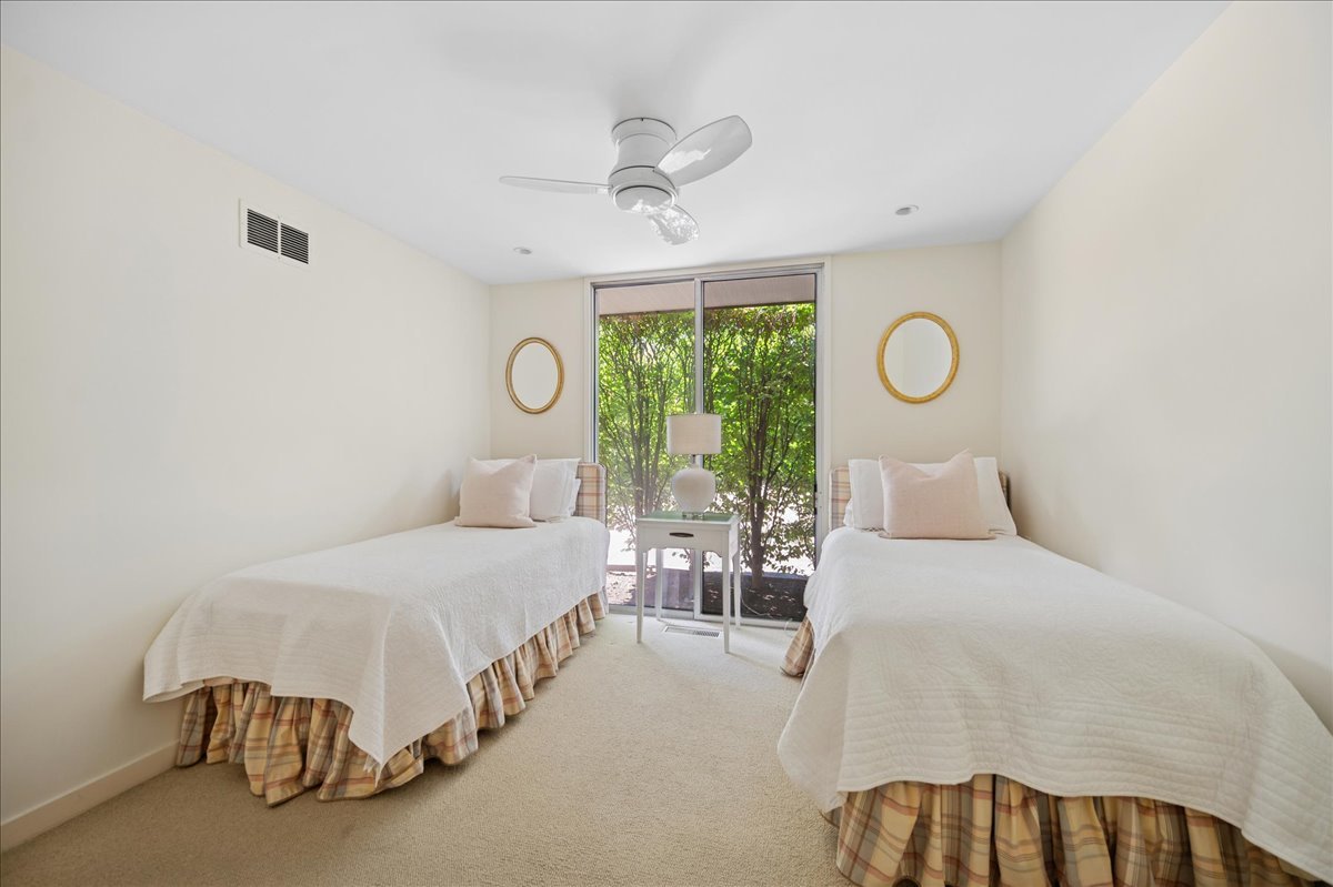 1045 Hillcrest Road Glencoe, IL 60022 - Photo 20 of 32 a bedroom with a bed and window