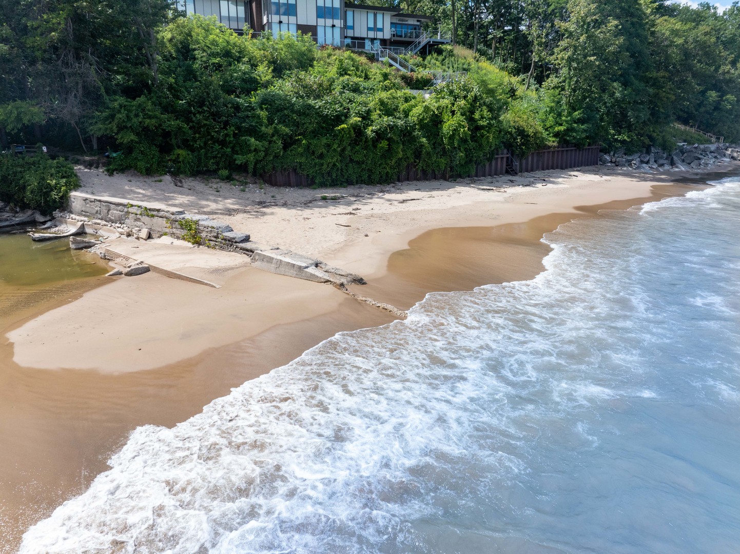 1045 Hillcrest Road Glencoe, IL 60022 - Photo 3 of 32 a view of a lake with beach