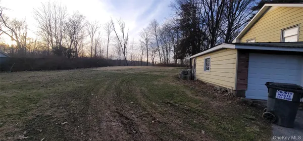 a view of backyard with green space
