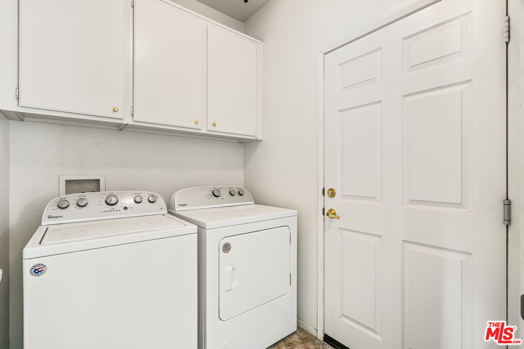 68420 Riviera Road Cathedral City, CA 92234 - Photo 17 of 42 a utility room with dryer and washer