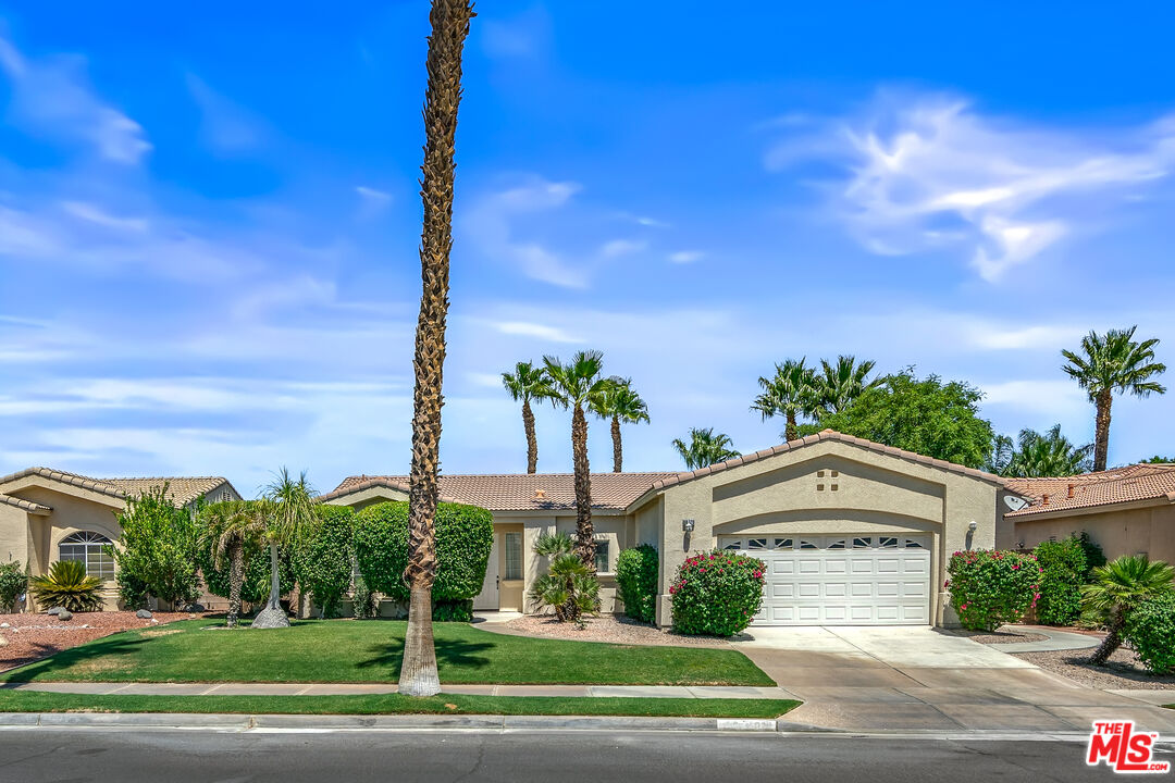 68420 Riviera Road Cathedral City, CA 92234 - Photo 2 of 42 a front view of a house with a yard