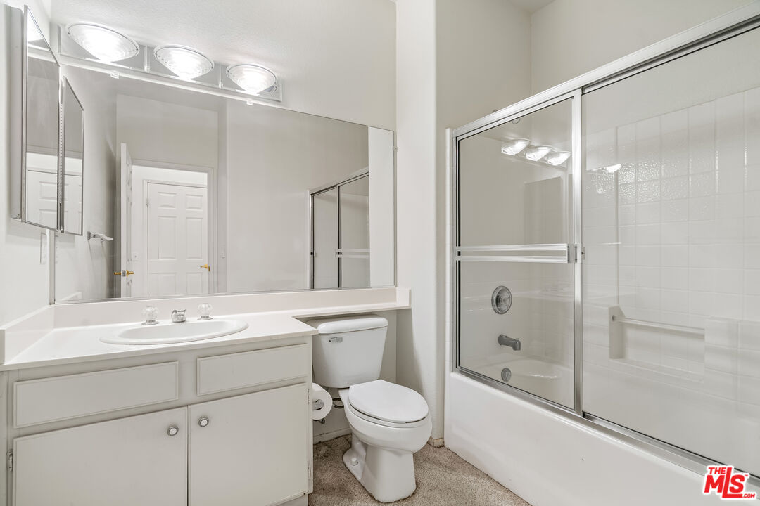 68420 Riviera Road Cathedral City, CA 92234 - Photo 29 of 42 a bathroom with a sink toilet tub and shower