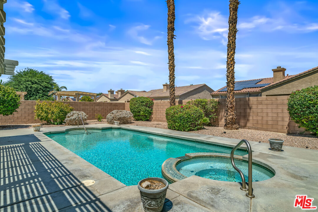 68420 Riviera Road Cathedral City, CA 92234 - Photo 35 of 42 a view of a swimming pool with a lounge chairs