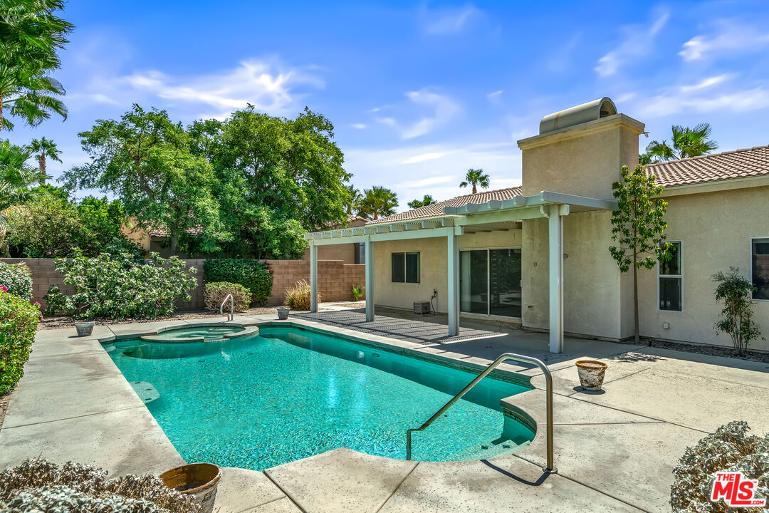 68420 Riviera Road Cathedral City, CA 92234 - Photo 41 of 42 a view of a house with backyard sitting area and garden