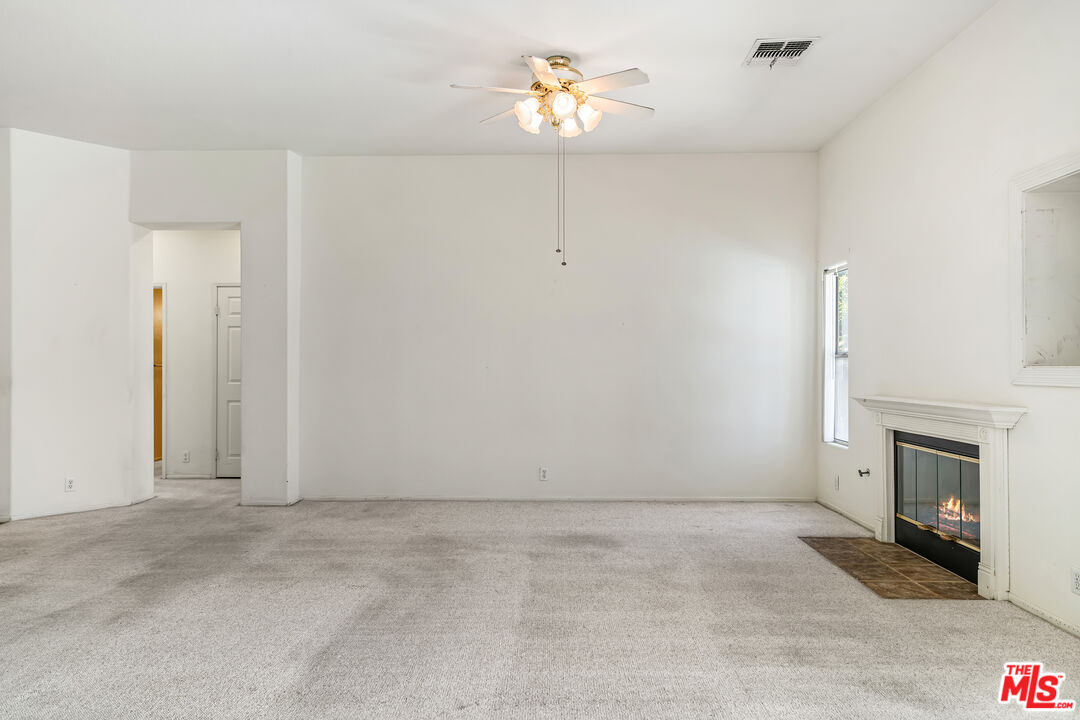 68420 Riviera Road Cathedral City, CA 92234 - Photo 8 of 42 a view of empty room with a fireplace