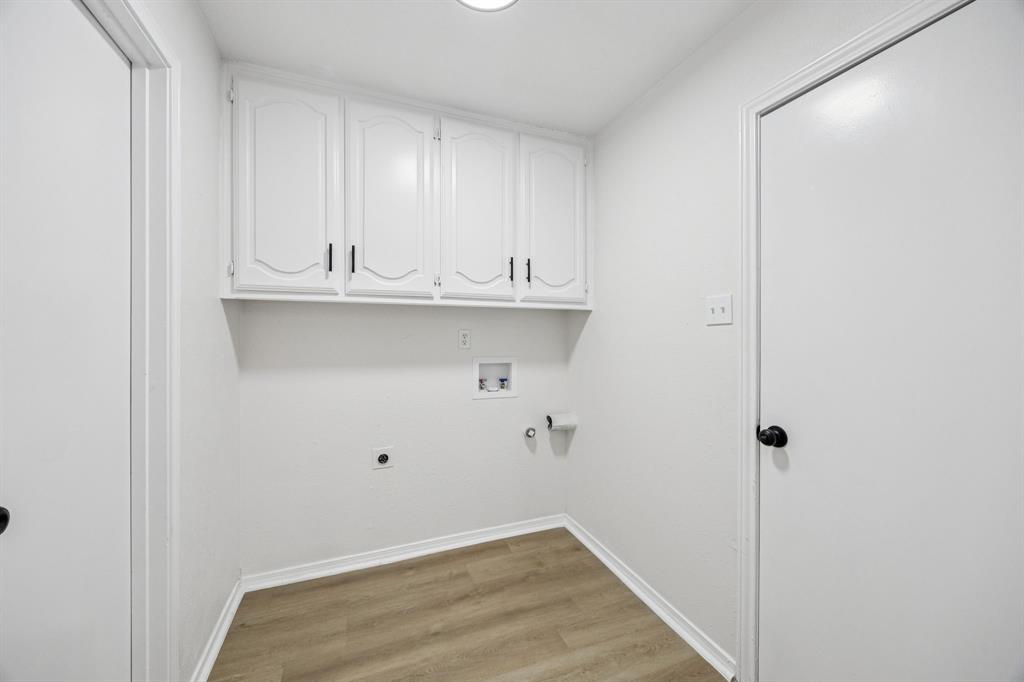 5909 Mark Lane Rowlett, TX 75089 - Photo 18 of 28 a view of small space with wooden floor