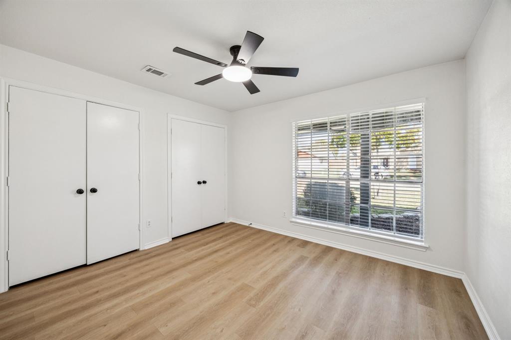 5909 Mark Lane Rowlett, TX 75089 - Photo 20 of 28 a view of an empty room with wooden floor and a window