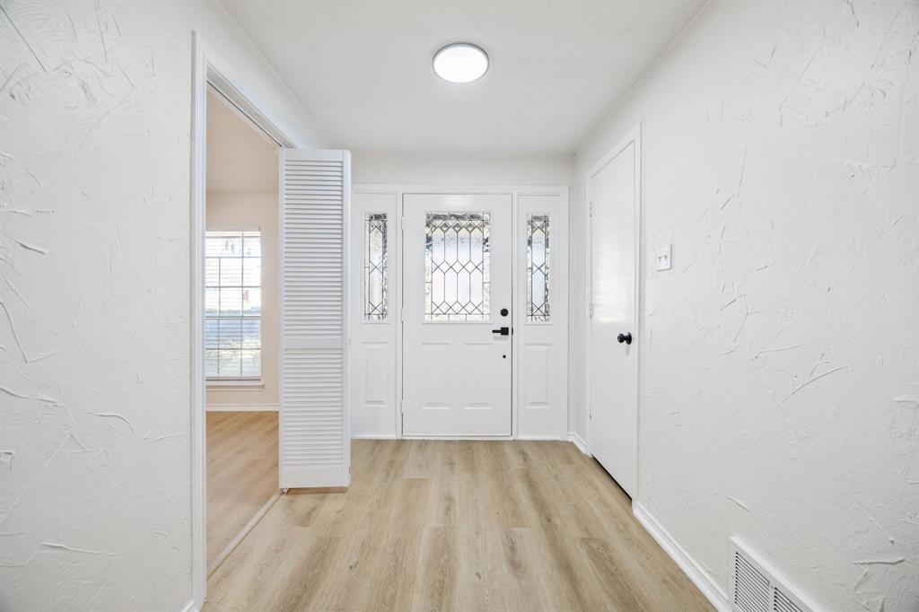 5909 Mark Lane Rowlett, TX 75089 - Photo 2 of 28 wooden floor in a room