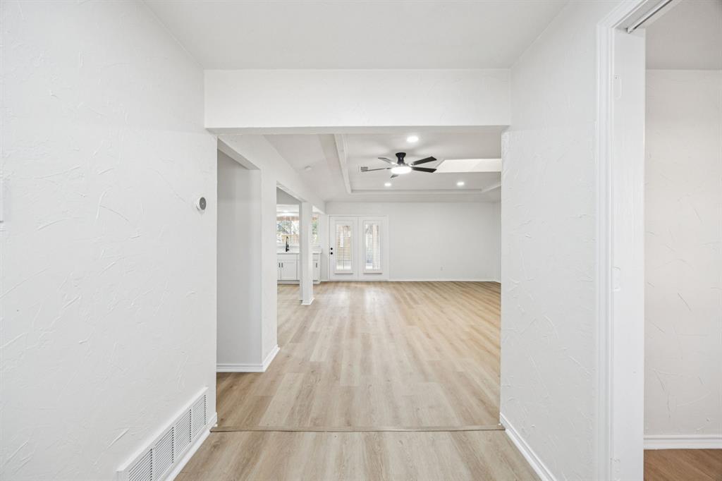 5909 Mark Lane Rowlett, TX 75089 - Photo 3 of 28 a view of an empty room with wooden floor