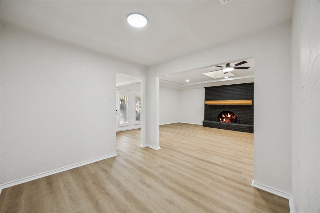 5909 Mark Lane Rowlett, TX 75089 - Photo 6 of 28 a view of empty room with wooden floor