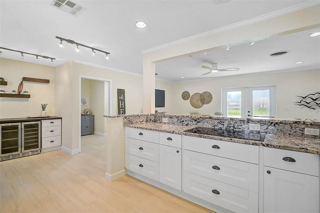 1099 Nokomis Avenue South Venice, FL 34285 - Photo 11 of 68 a bathroom with a granite countertop sink mirror and window