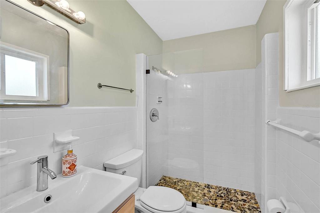 1099 Nokomis Avenue South Venice, FL 34285 - Photo 24 of 68 a bathroom with a sink toilet and shower