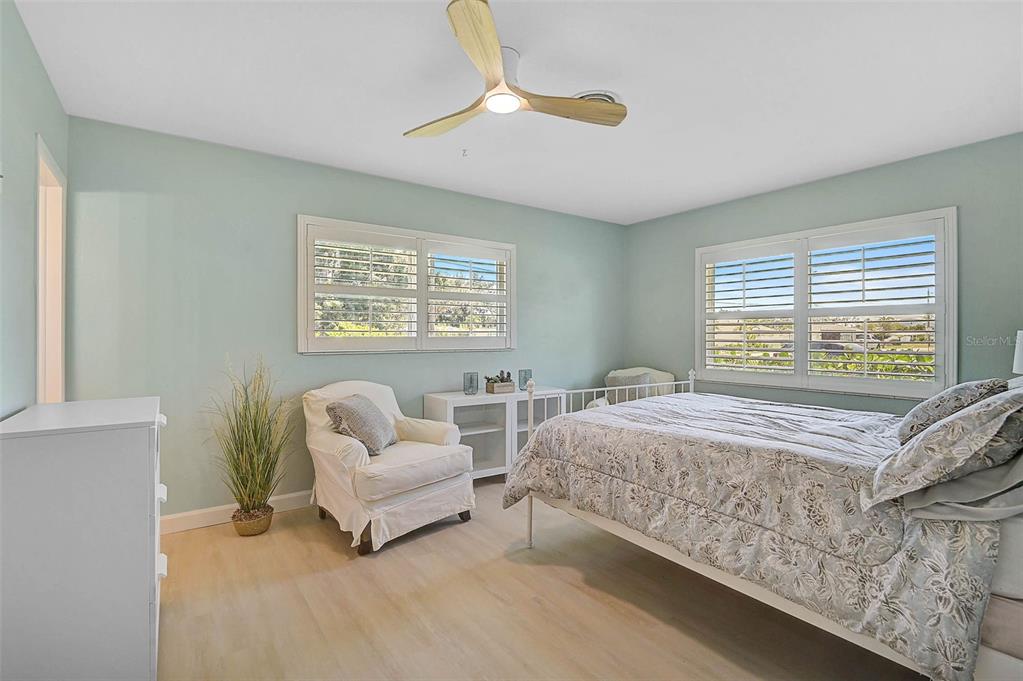1099 Nokomis Avenue South Venice, FL 34285 - Photo 26 of 68 a bed room with a bed and a couch