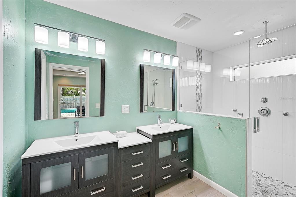 1099 Nokomis Avenue South Venice, FL 34285 - Photo 31 of 68 a bathroom with a double vanity sink mirror and double