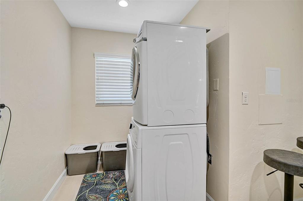 1099 Nokomis Avenue South Venice, FL 34285 - Photo 33 of 68 a bedroom with a bed and a window