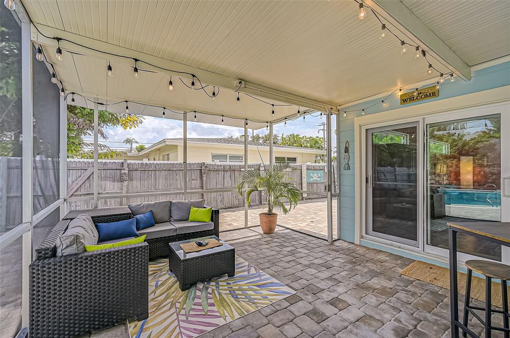 1099 Nokomis Avenue South Venice, FL 34285 - Photo 36 of 68 a outdoor space with patio couch and glass door