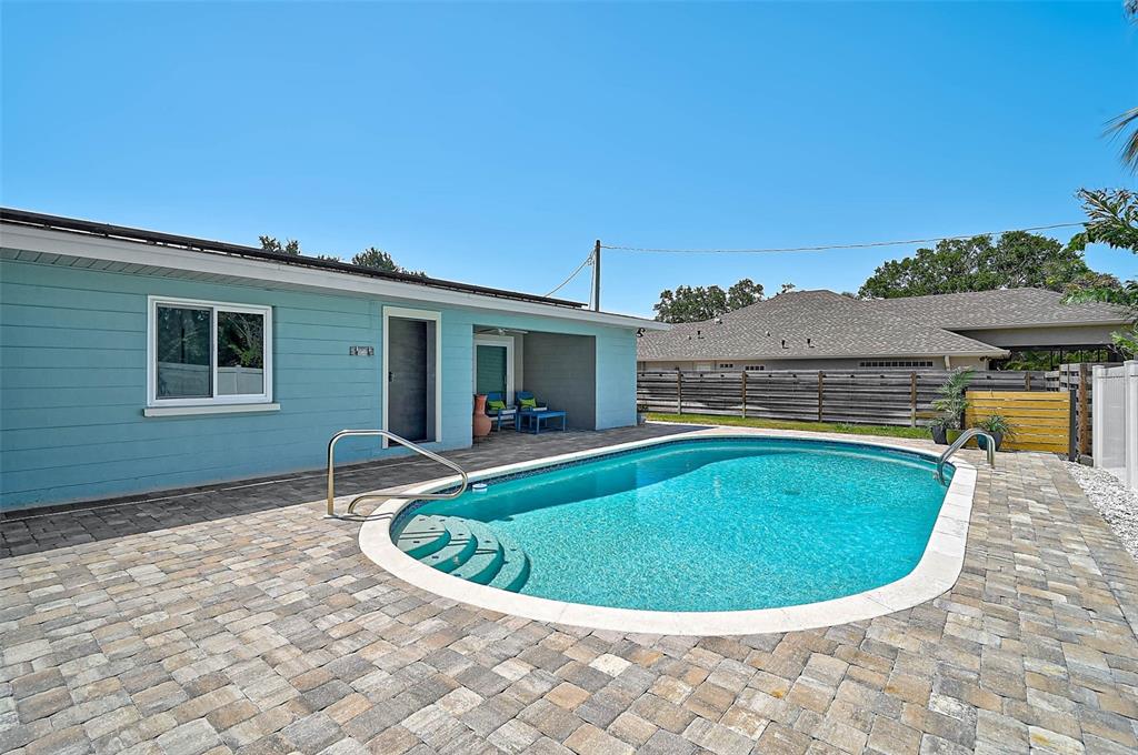 1099 Nokomis Avenue South Venice, FL 34285 - Photo 42 of 68 a view of a swimming pool with back yard