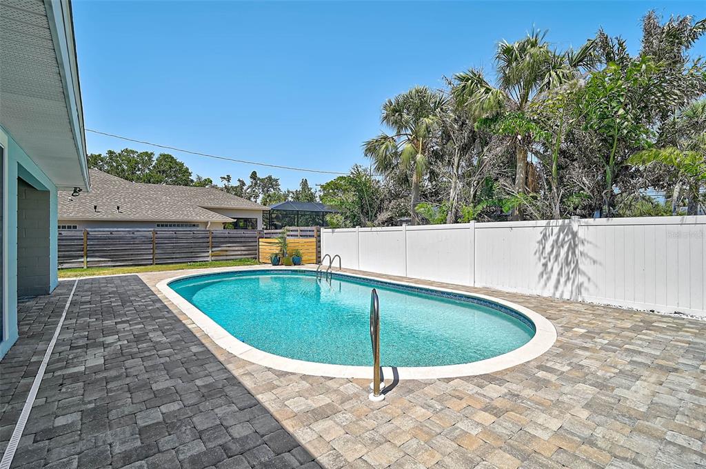 1099 Nokomis Avenue South Venice, FL 34285 - Photo 44 of 68 a view of a swimming pool with an outdoor seating