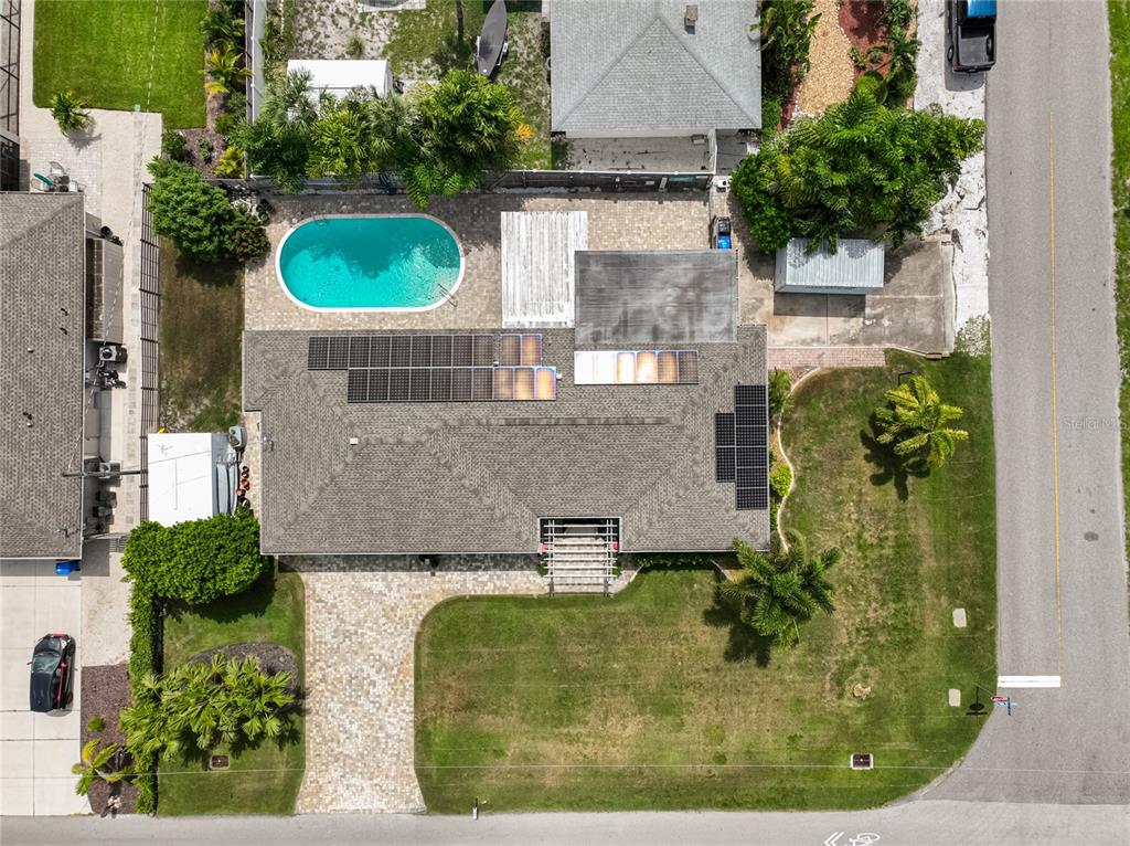 1099 Nokomis Avenue South Venice, FL 34285 - Photo 46 of 68 an aerial view of a house with a swimming pool