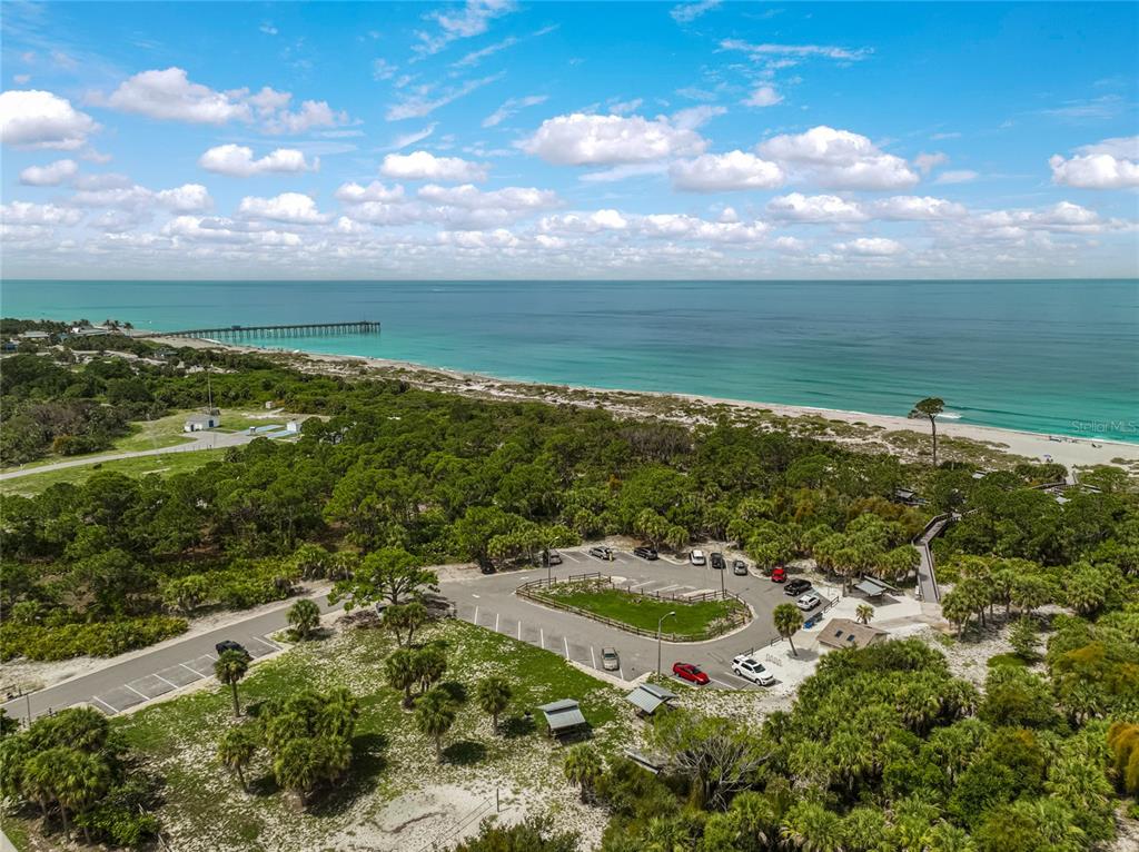 1099 Nokomis Avenue South Venice, FL 34285 - Photo 49 of 68 a view of a lake with a yard