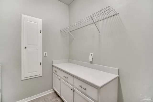 a bathroom with a sink vanity and a mirror