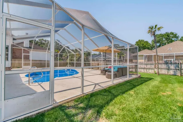 a view of a backyard with sitting area