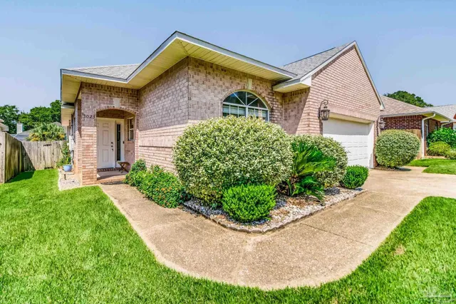front view of a house with a yard