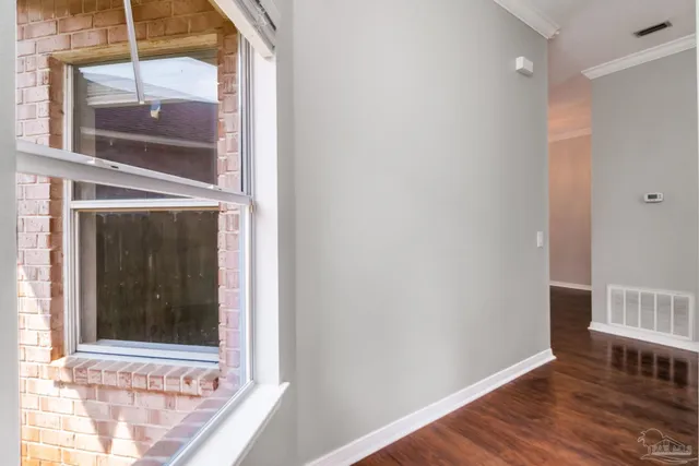 a view of a door and a window